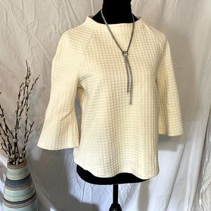 Audrey Hepburn inspired top. 3/4 bell sleeve with boat neck faux funnel collar.